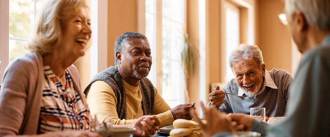 a group of seniors around a table
